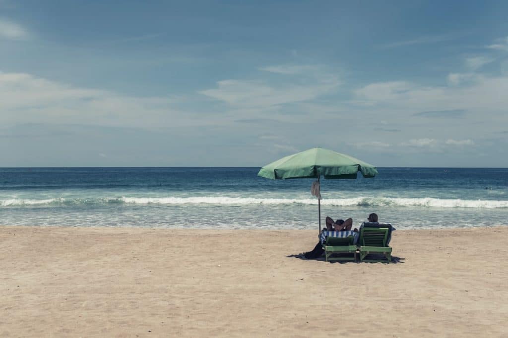 Beach with green umbrella