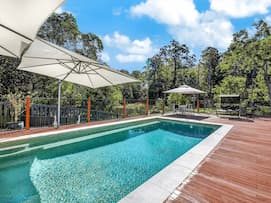 Pool With Parasol — Seniors Real Estate in Gold Coast, QLD